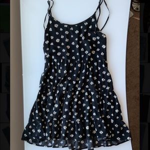 A white daisy floral dress with an open back concept